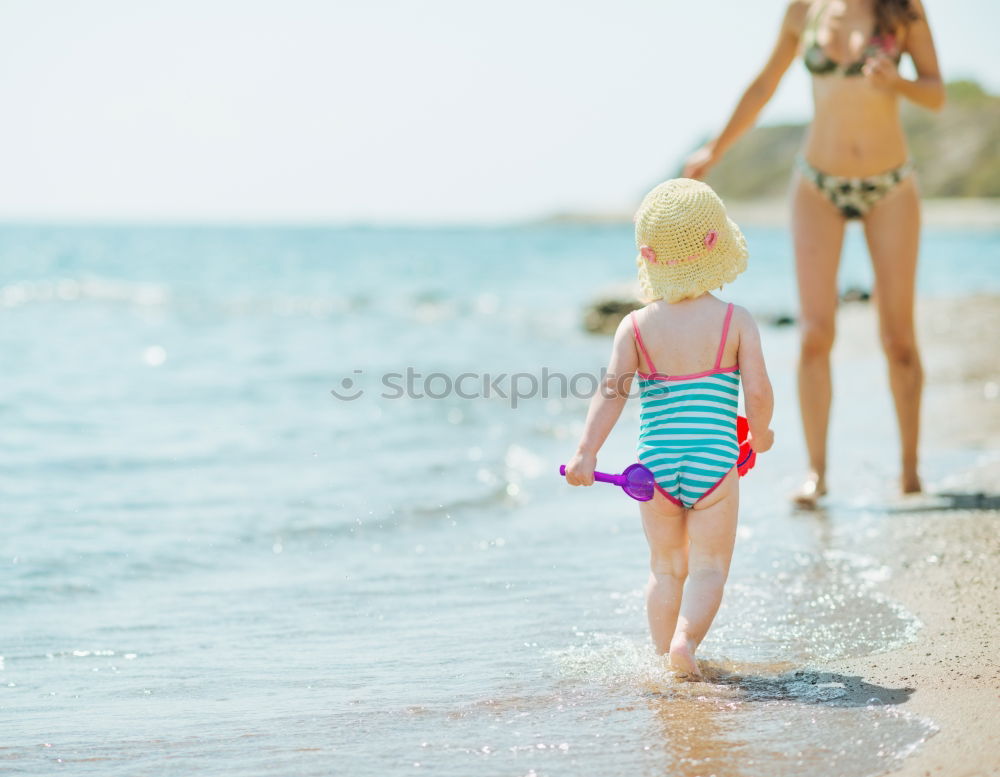 Similar – Two happy children playing on the beach