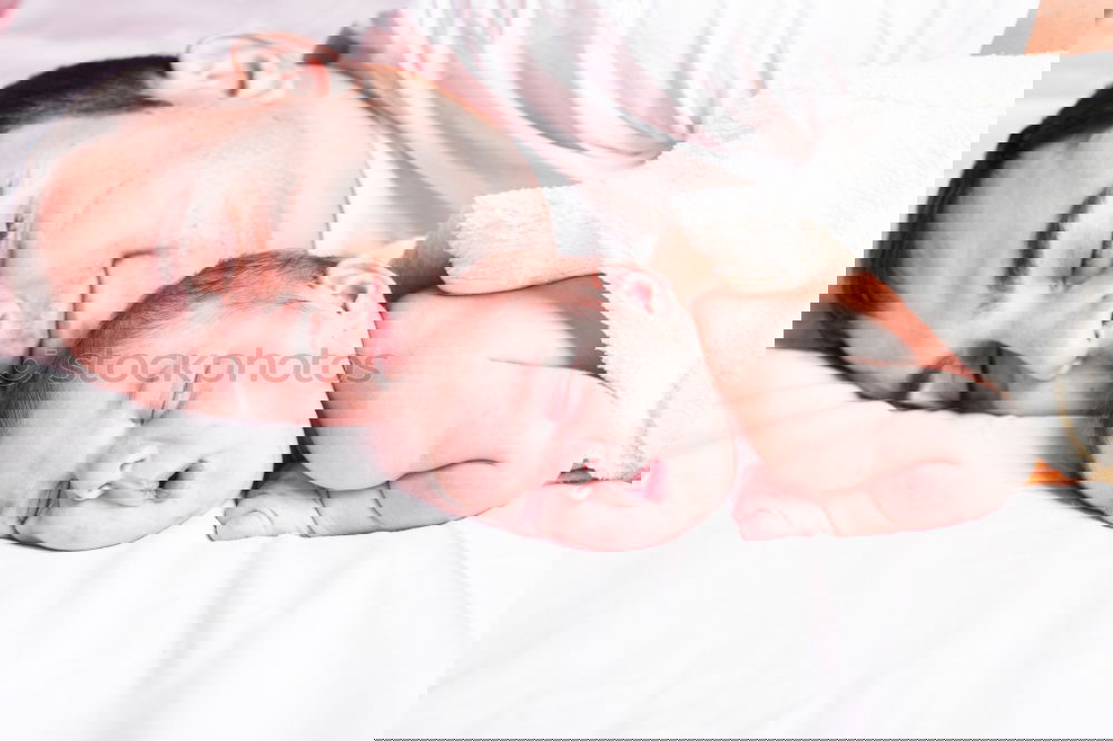 Similar – Image, Stock Photo Man kissing to peaceful newborn lying over bed