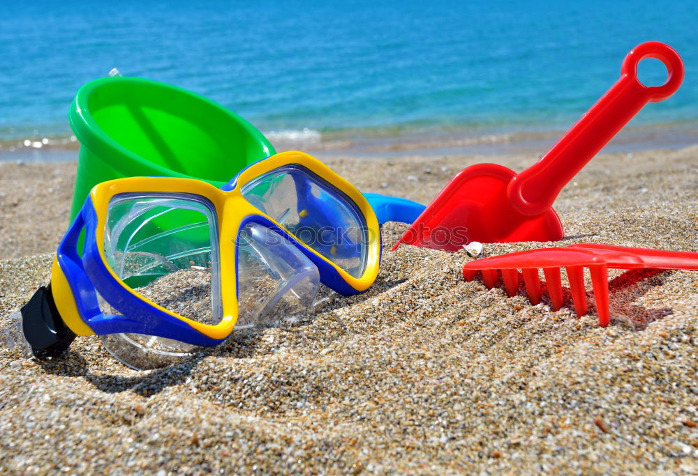 Similar – Image, Stock Photo Towel, beach ball, sunscreen and water gun on the beach