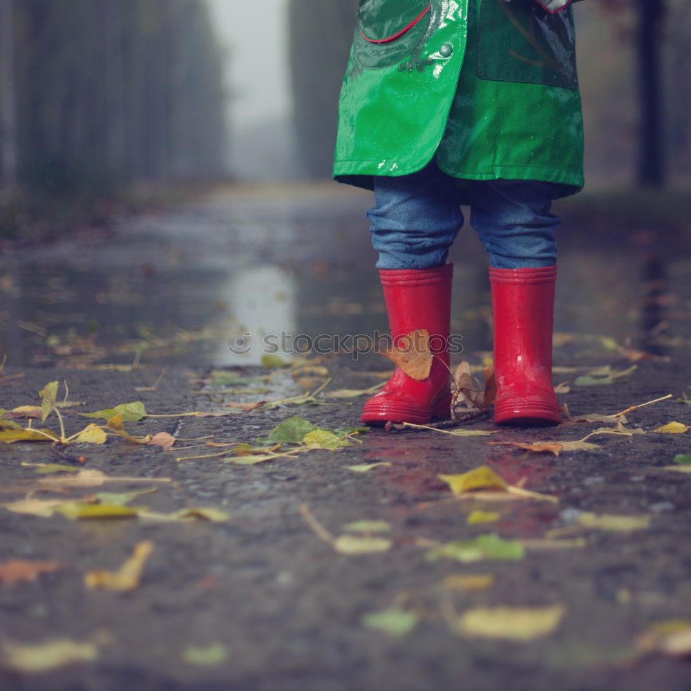 Similar – Rubber boots in the mud