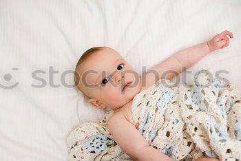 Similar – Image, Stock Photo Portrait of newborn baby lying down over a blanket