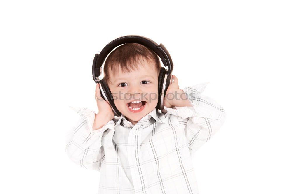 Child with headphones, listening to music