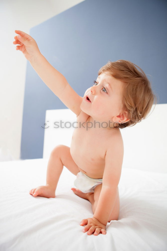 Baby with one years old getting out of bed