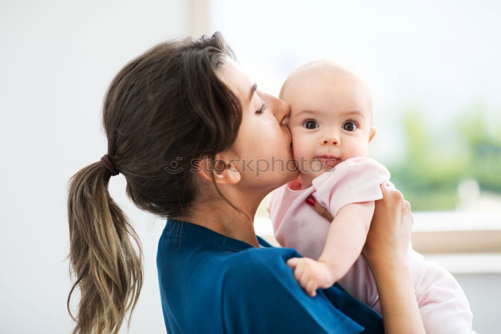 Similar – Image, Stock Photo Mother doing her little daughter’s hair. Family at home. Everyday life