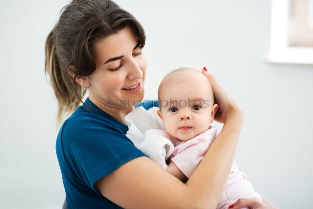 Similar – Image, Stock Photo Mother doing her little daughter’s hair. Family at home. Everyday life
