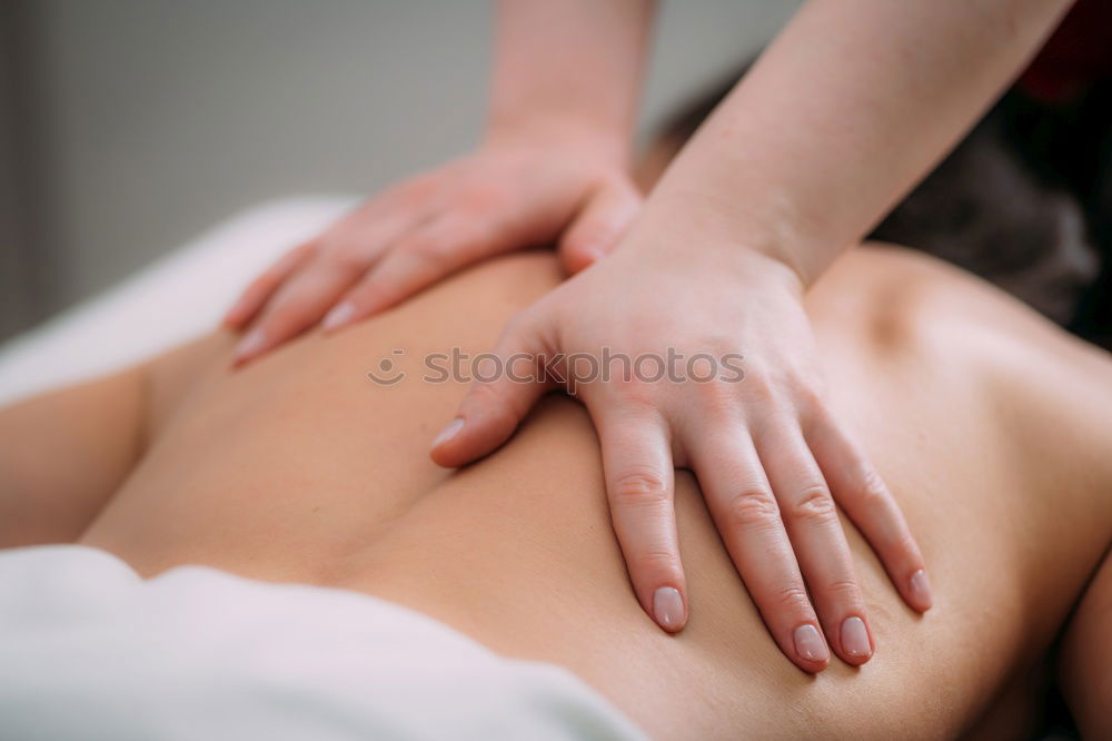 Similar – Image, Stock Photo Woman receiving massage on shoulders in clinical center