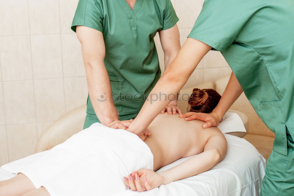 Similar – Massage therapist doing lymphatic drainage treatment to woman