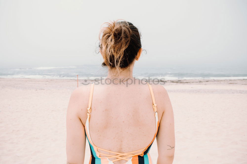 Similar – Asian woman standing on the terrace and looking around the sea.