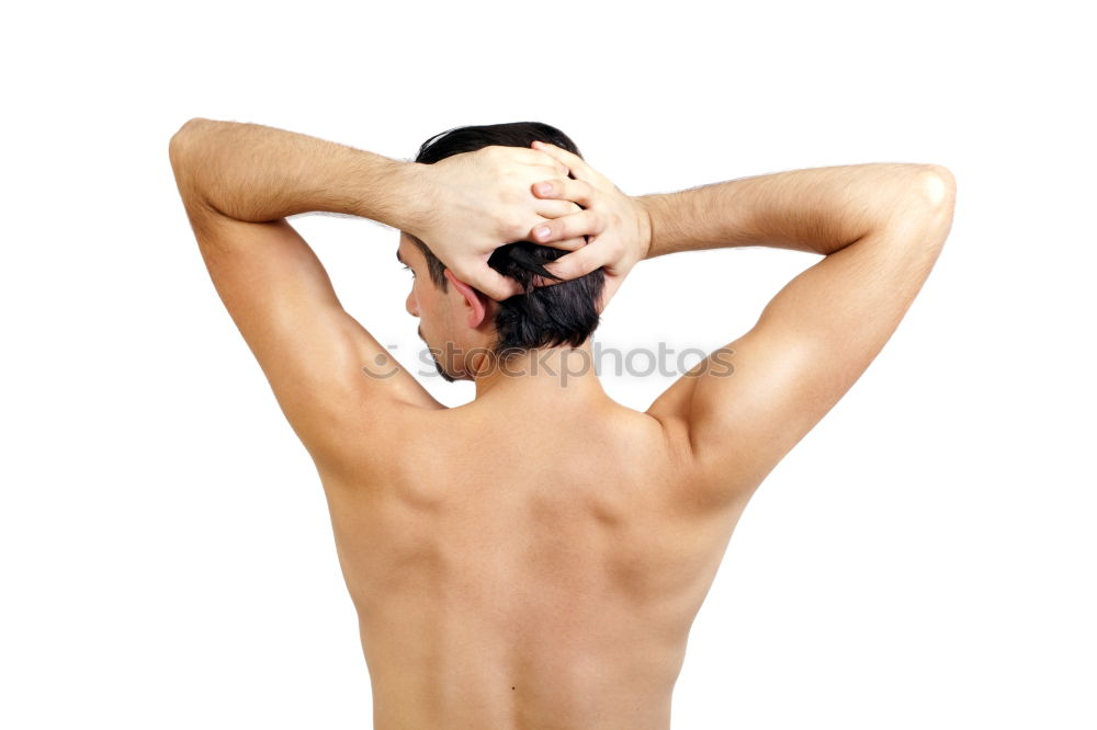 Similar – young woman with very short hair stands naked in front of light turquoise wall in pose with half raised arms