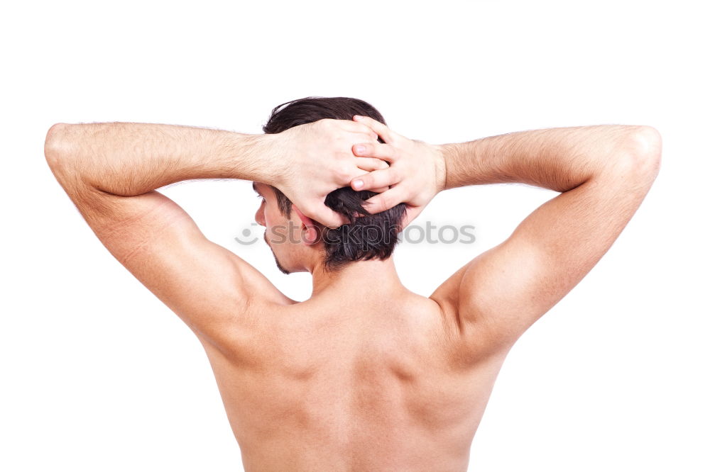 Similar – young woman with very short hair stands naked in front of light turquoise wall in pose with half raised arms