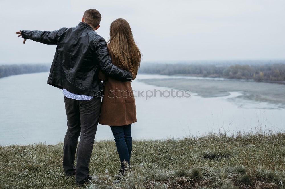 Women standing at lake