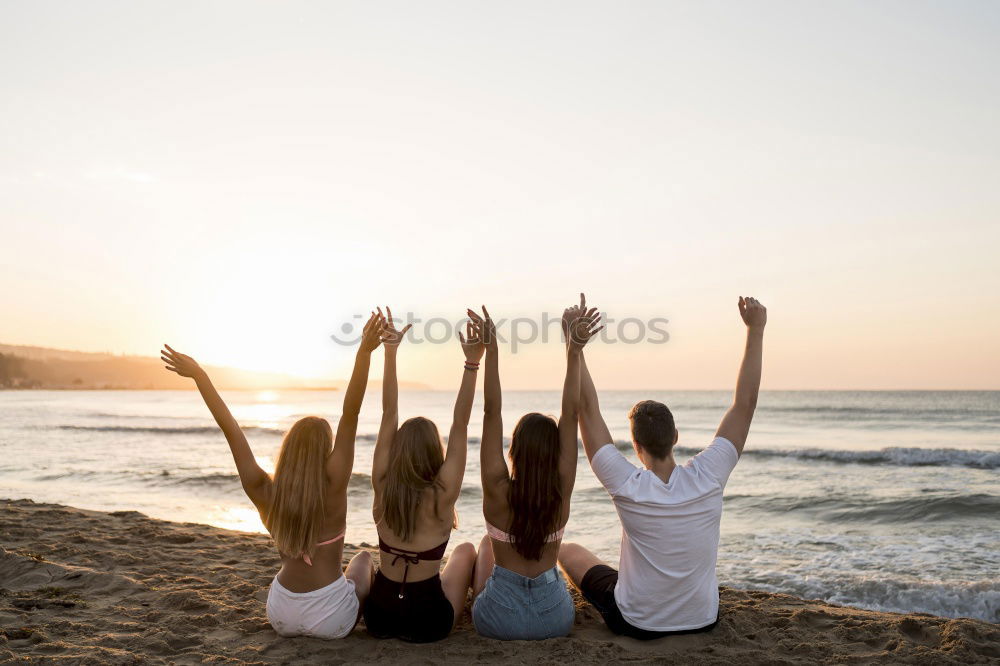 Image, Stock Photo Group of happy friends celebrating with drinks in sunset