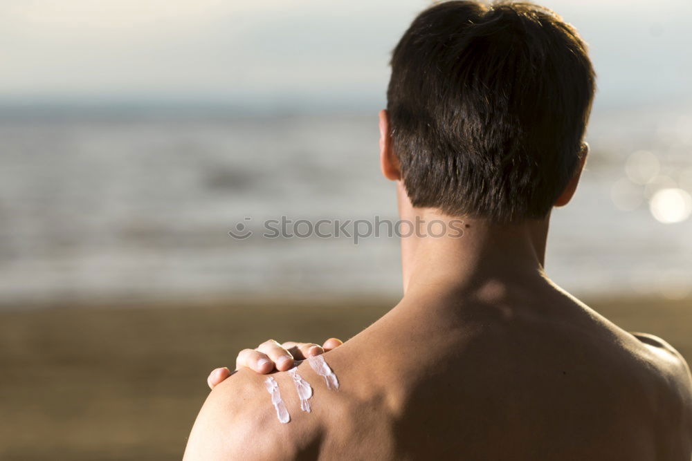 Similar – Diver in wet suit standing on beach