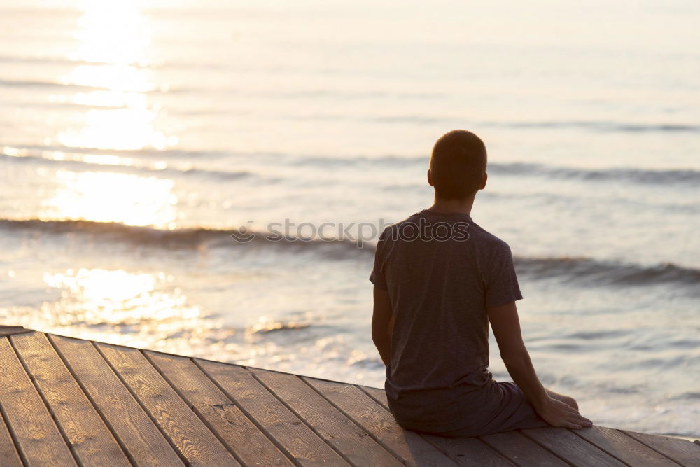 Similar – Image, Stock Photo Thoughtful child sit at waterfront. Back view