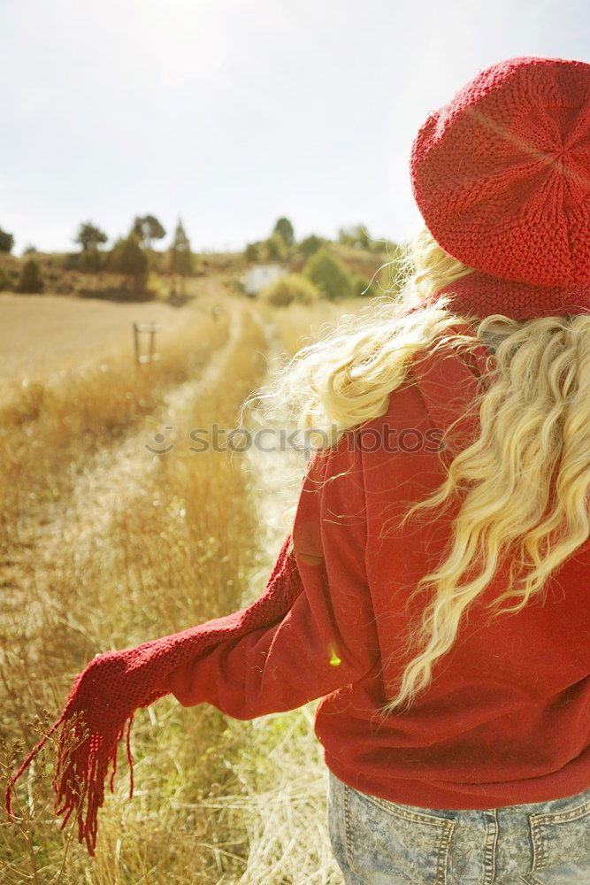 Image, Stock Photo Back view of a young woman in nature in a sunny autumn day