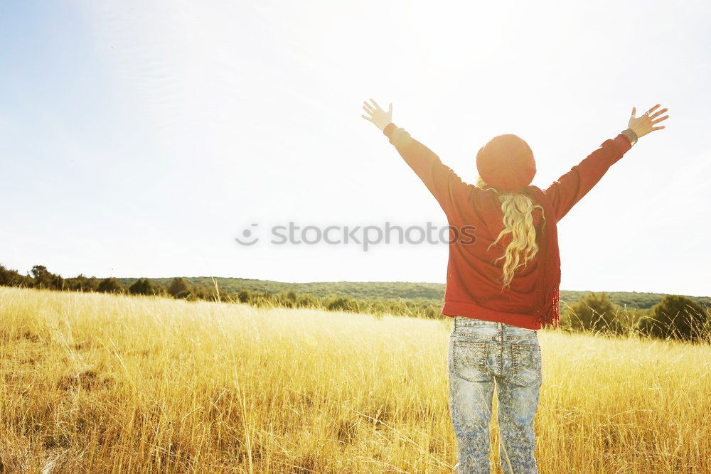 Image, Stock Photo Back view of a young woman in nature in a sunny autumn day