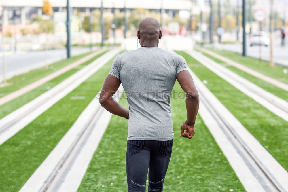 Similar – Rear view of black man running in urban background.