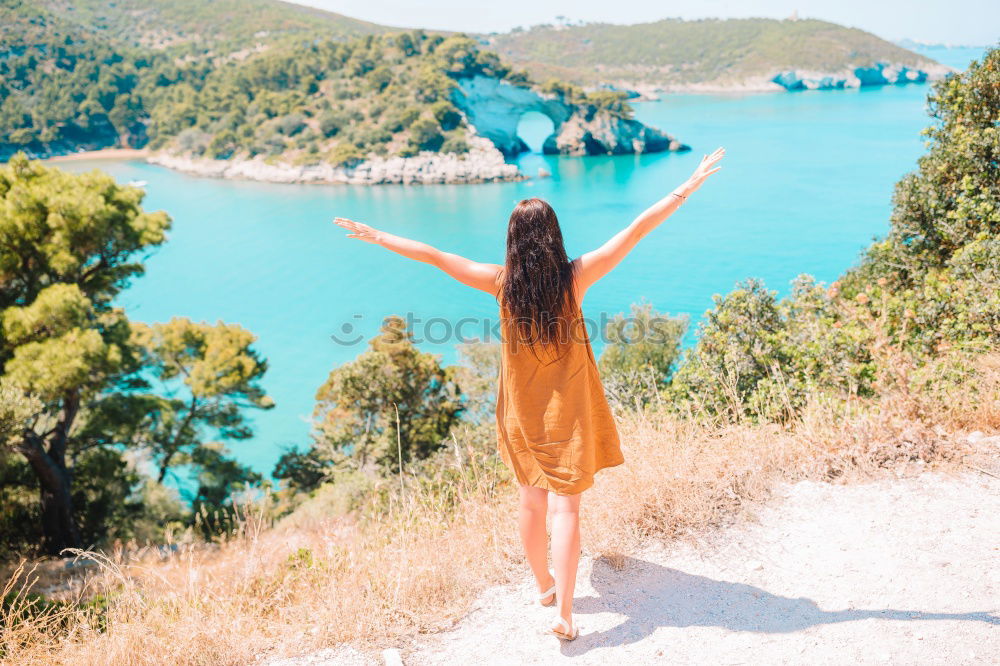 Similar – Happy girl posing on the stones of a river