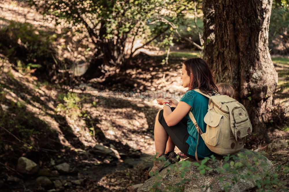 Similar – Image, Stock Photo Young woman is packing her backpack during hiking in summer nature. Concepts of adventure, extreme survival, orienteering. Equipments for hike.