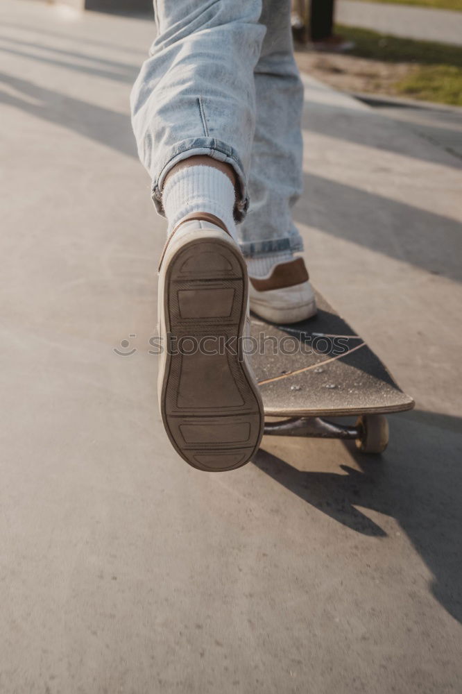 Similar – Person rides the skateboard