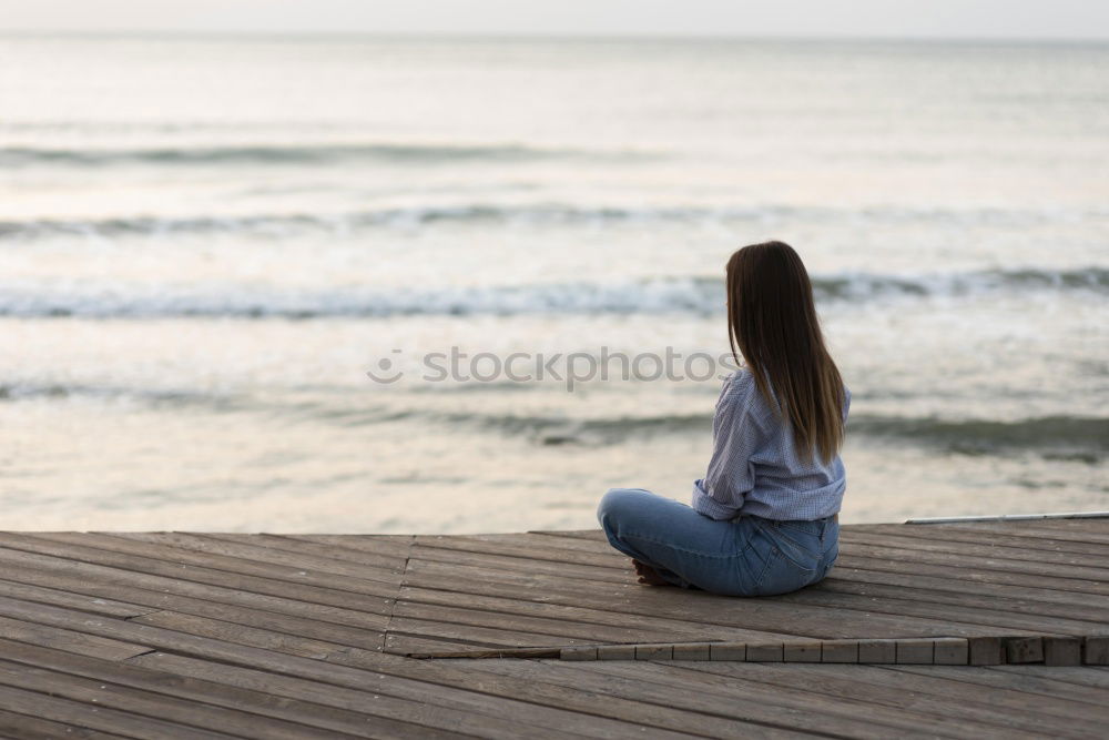 Similar – Image, Stock Photo Thoughtful child sit at waterfront. Back view