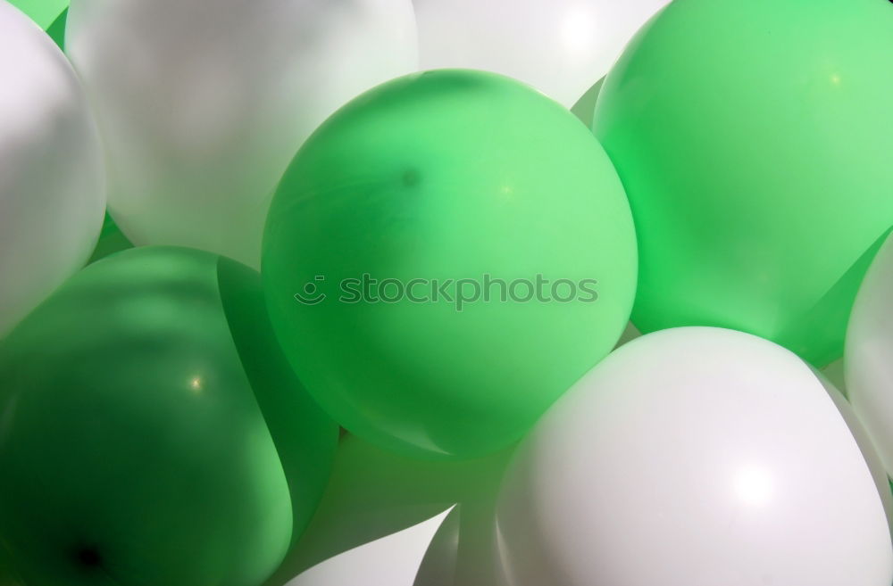 Similar – Green balloons vs. twigs