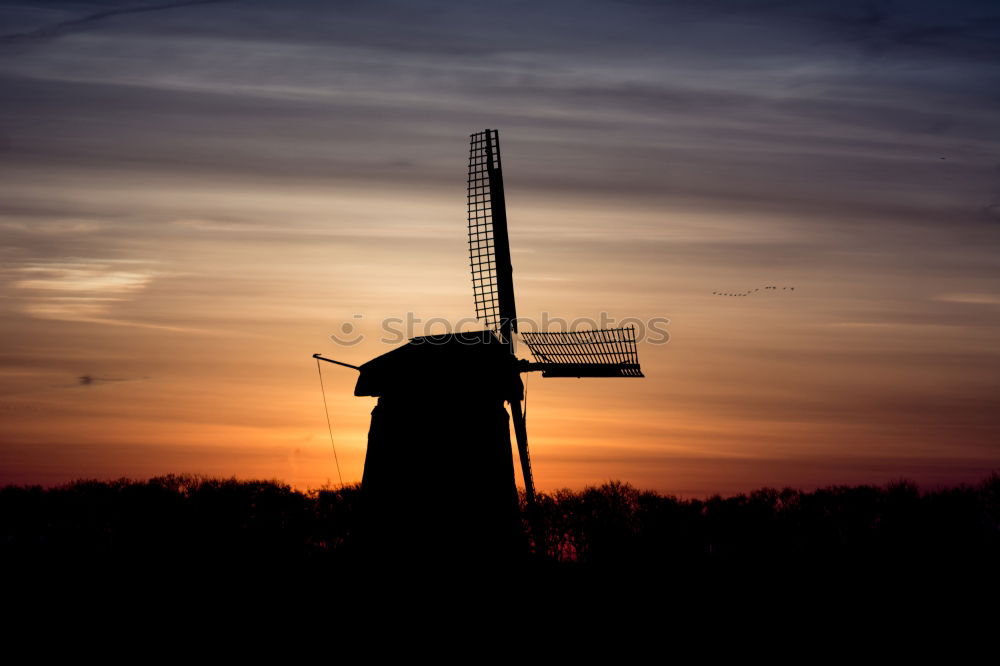 Similar – charming windmill by river at sunrise