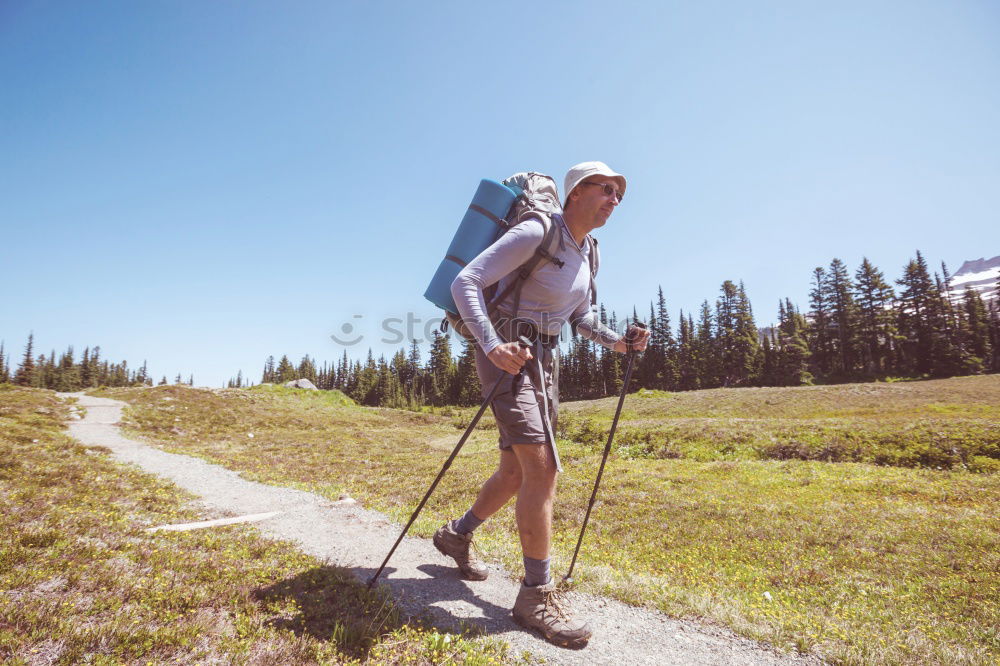 Similar – Foto Bild Frau mit Rucksack und Wanderstöcke