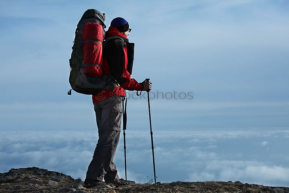 Similar – Male hiker standing on the top of a mountain.