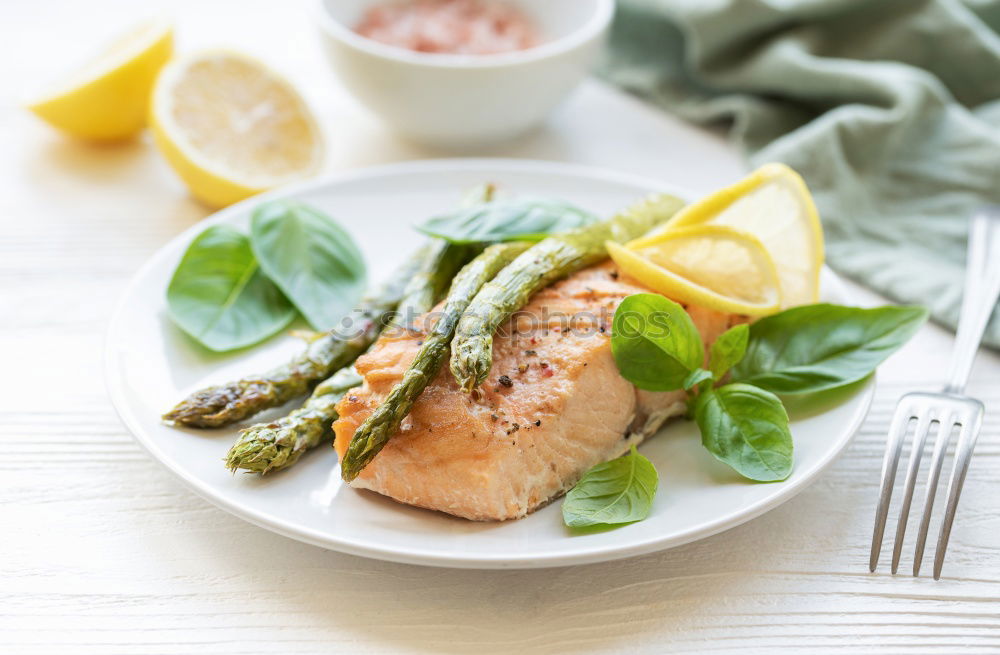 Similar – Fry salmon fillet with dill, lemon, oil and tomatoes