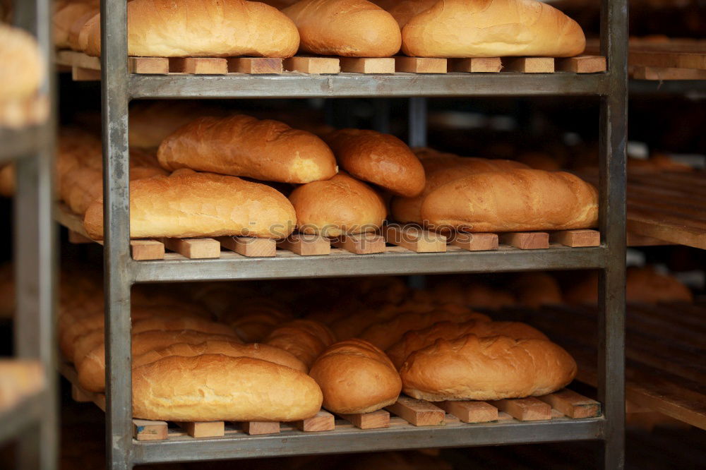 Similar – Baker carrying rack with fresh pastry