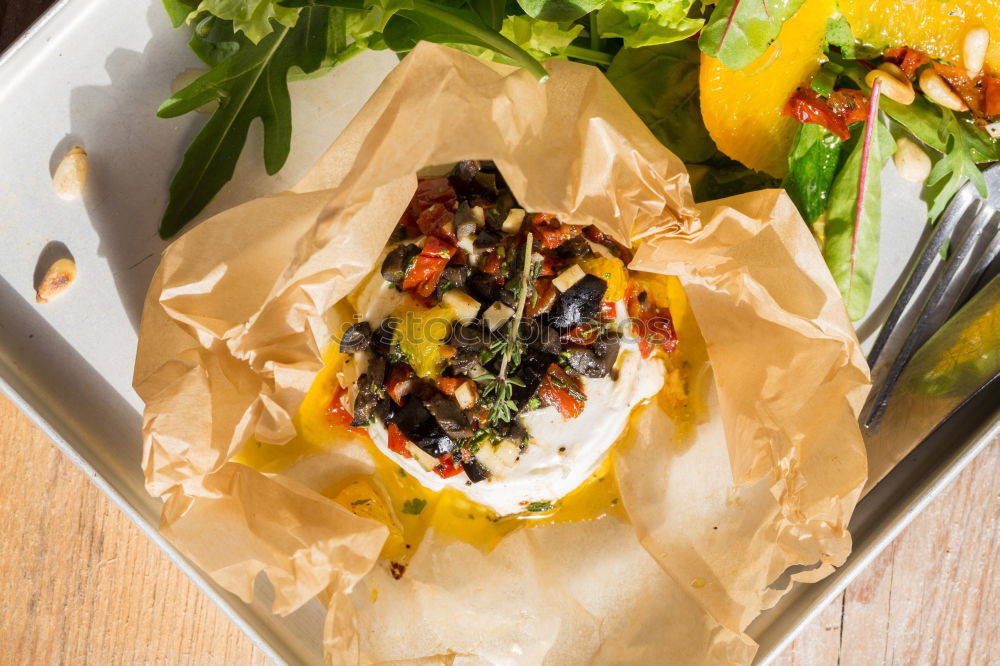 Similar – Image, Stock Photo Mediterranean goat cheese baked in parchment paper