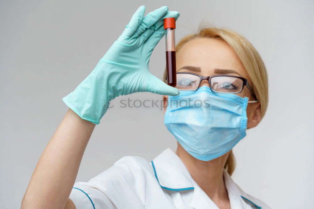 Similar – Image, Stock Photo Female doctor with face mask, protective gloves and lab coat