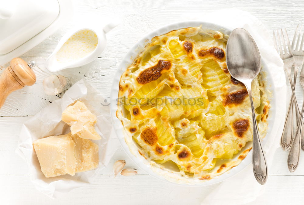 Similar – Image, Stock Photo Female hands holding casserole dish with pasta casserole