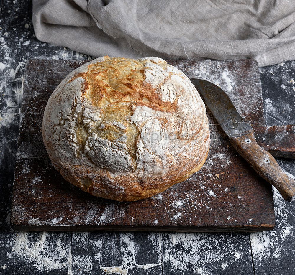 Image, Stock Photo baked round white wheat bread