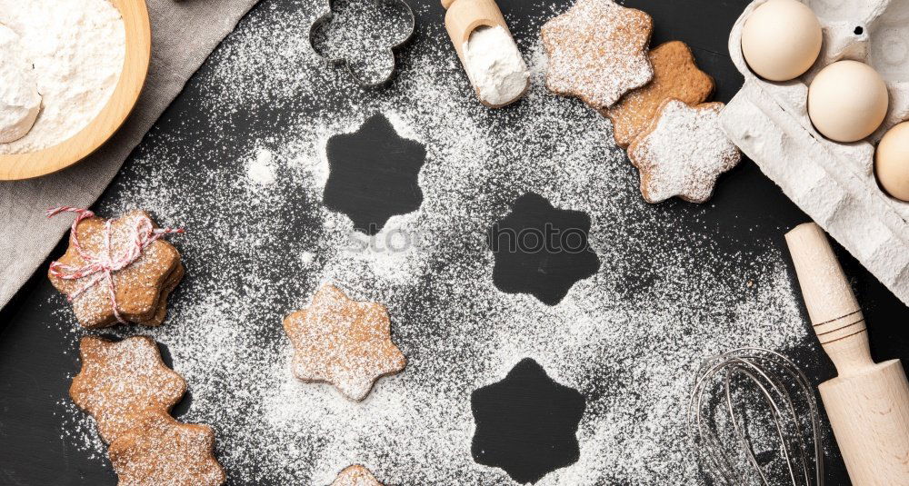 Image, Stock Photo Close up of cookie cutters in a dough on a dark table