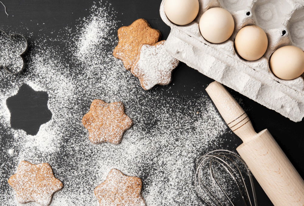 Similar – Girl cutting out the Christmas symbols in the dough