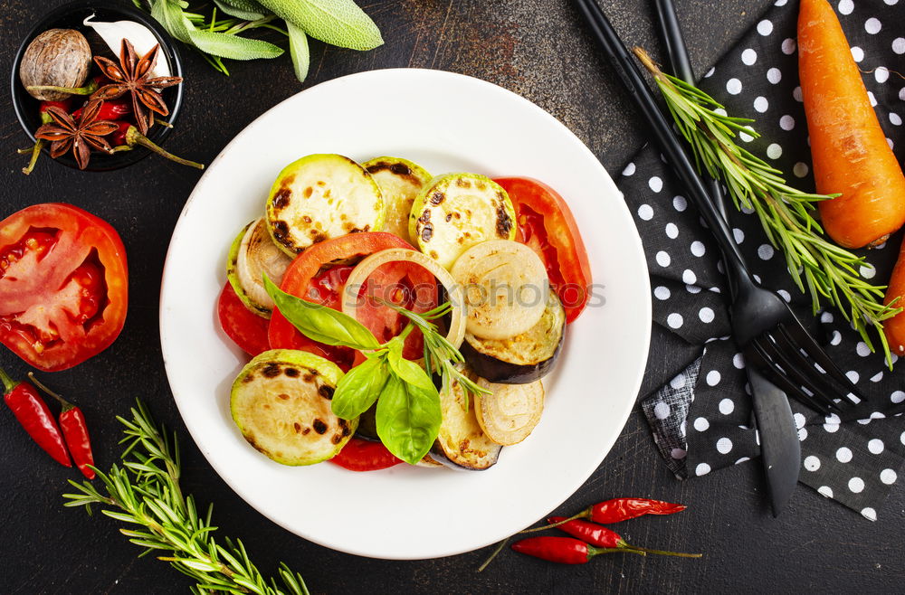 Similar – Fish baked with vegetable garnish