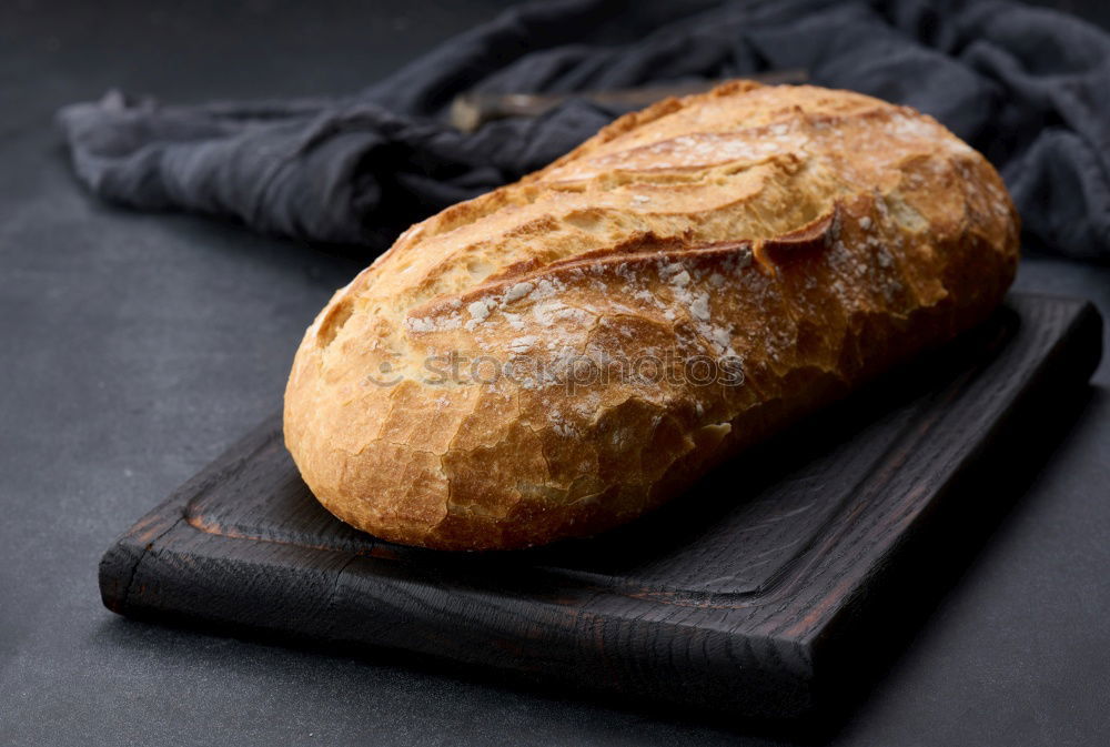 Similar – Image, Stock Photo baked round white wheat bread