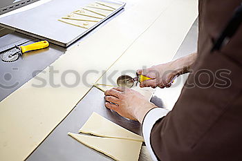 Similar – Image, Stock Photo Young man looks curiously over a barrier