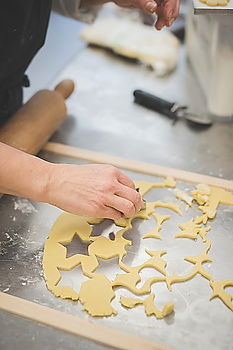 Similar – woman in bakery preparing sweets adding egg