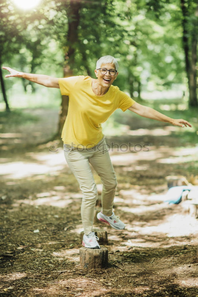 Similar – Happy senior couple on a hike trough green fields