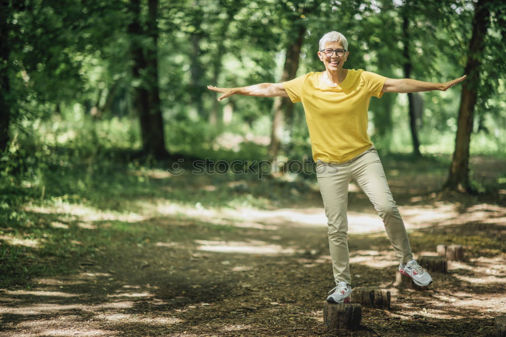 Similar – Happy senior couple on a hike trough green fields