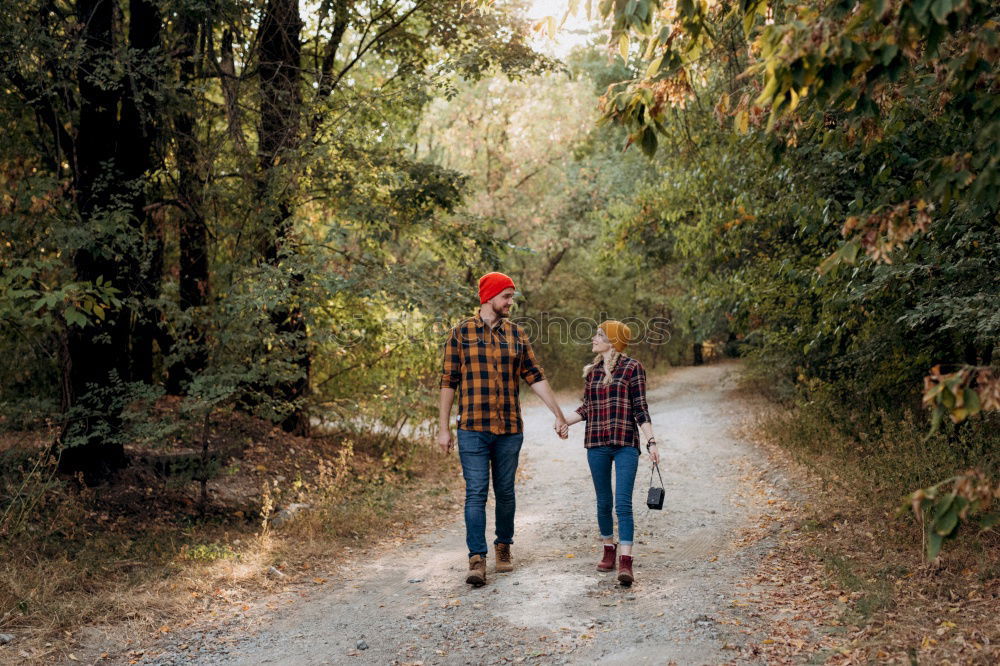 Similar – Elferly fit happy couple hiking through forest together on vacation