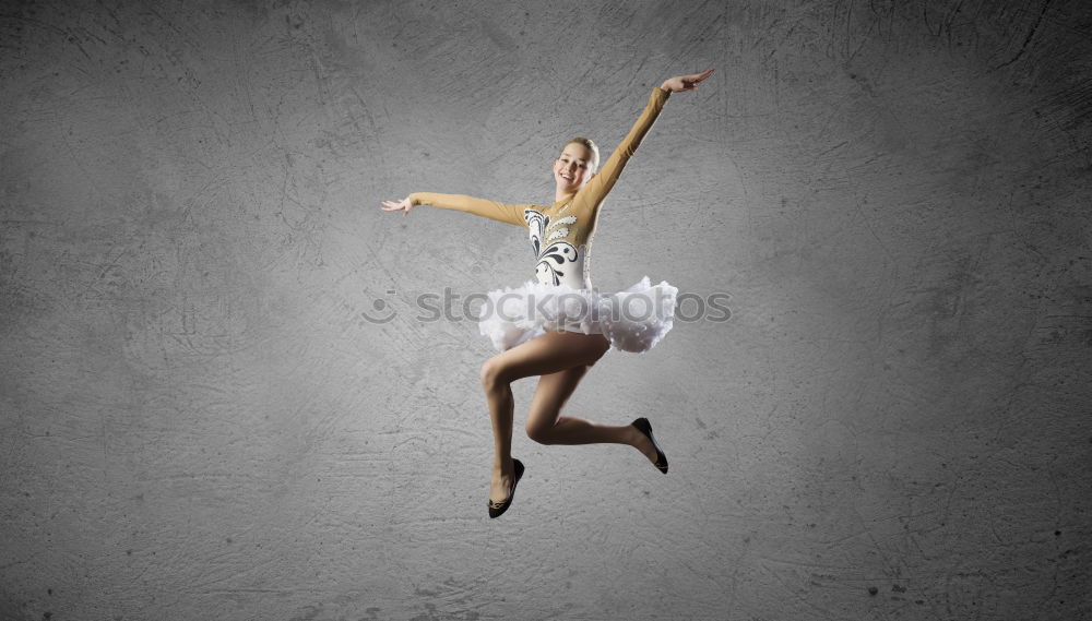 Similar – Top view at ballet dancer tying slippers around her ankle