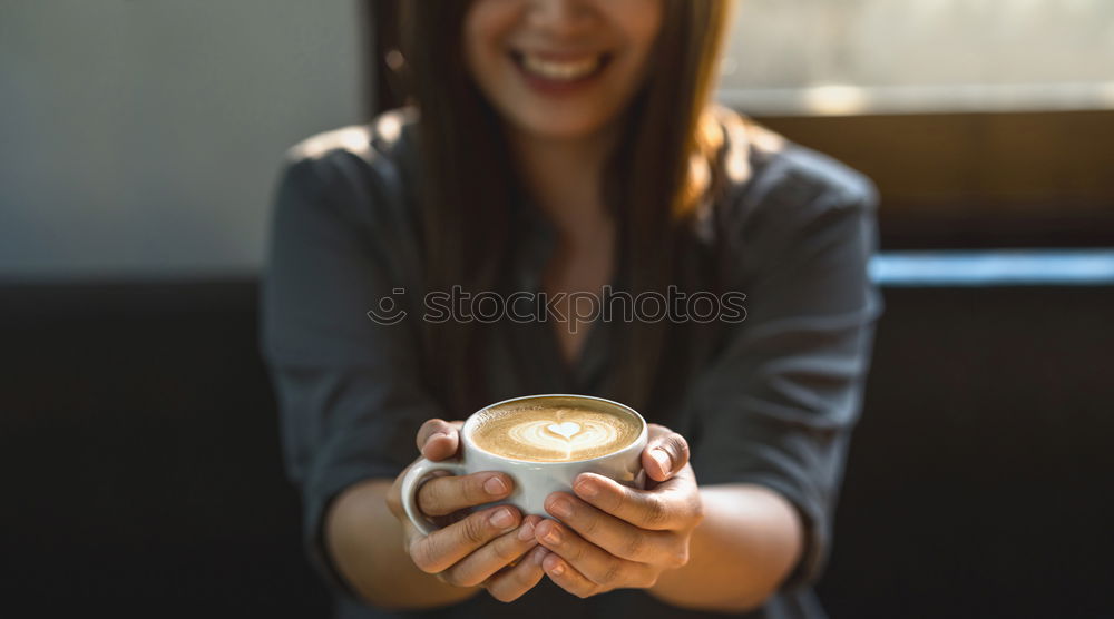 Similar – beauty girl sitting in a coffee shop with a cup in her hands