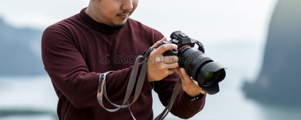 Similar – Young modern man sitting on halfpipe taking picture with Camera