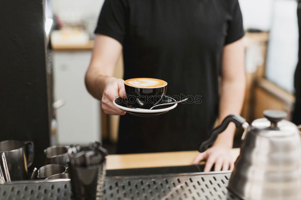 Similar – Image, Stock Photo Barista holds out a Cup of coffee