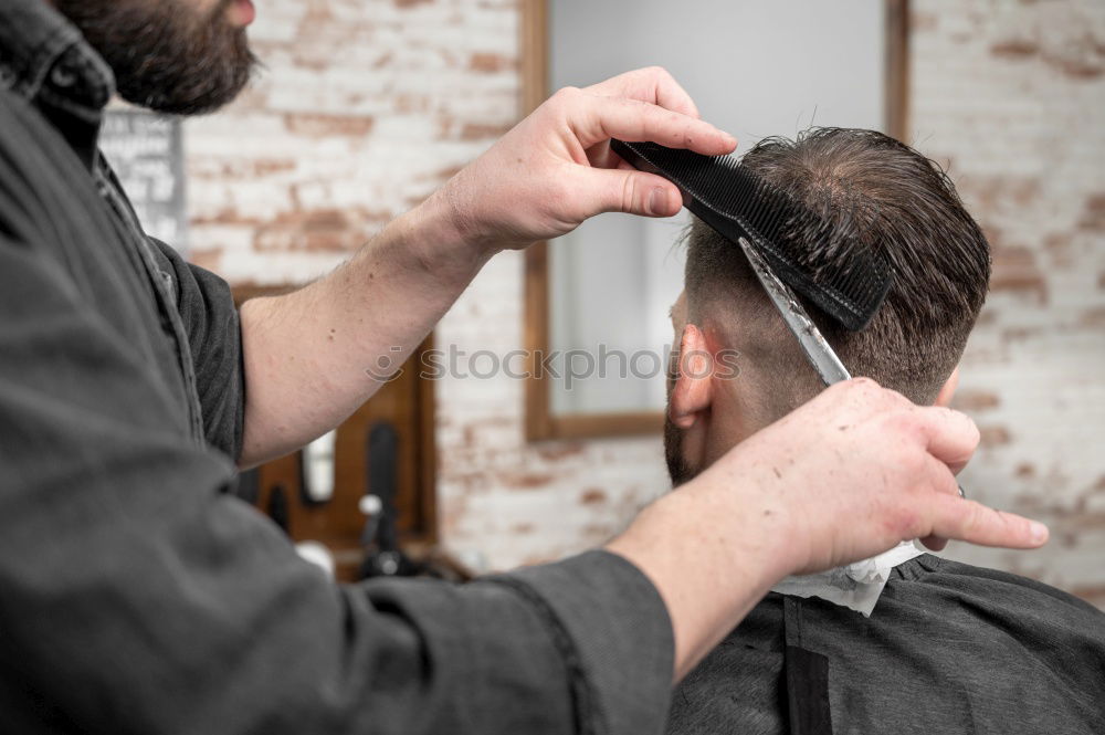 Similar – Barber doing face massage to man