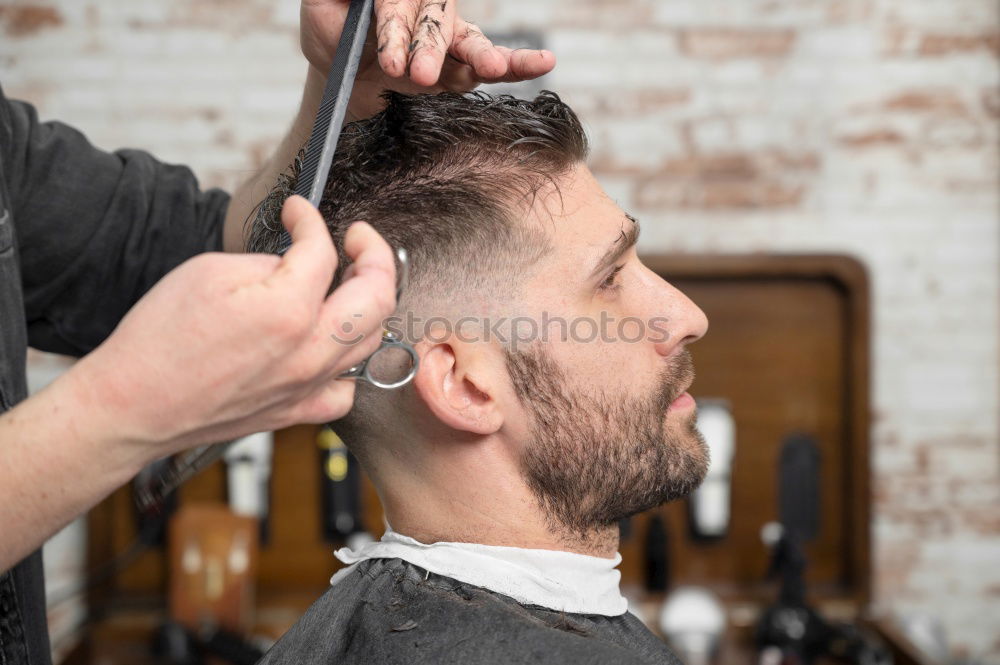 Similar – Barber doing face massage to man